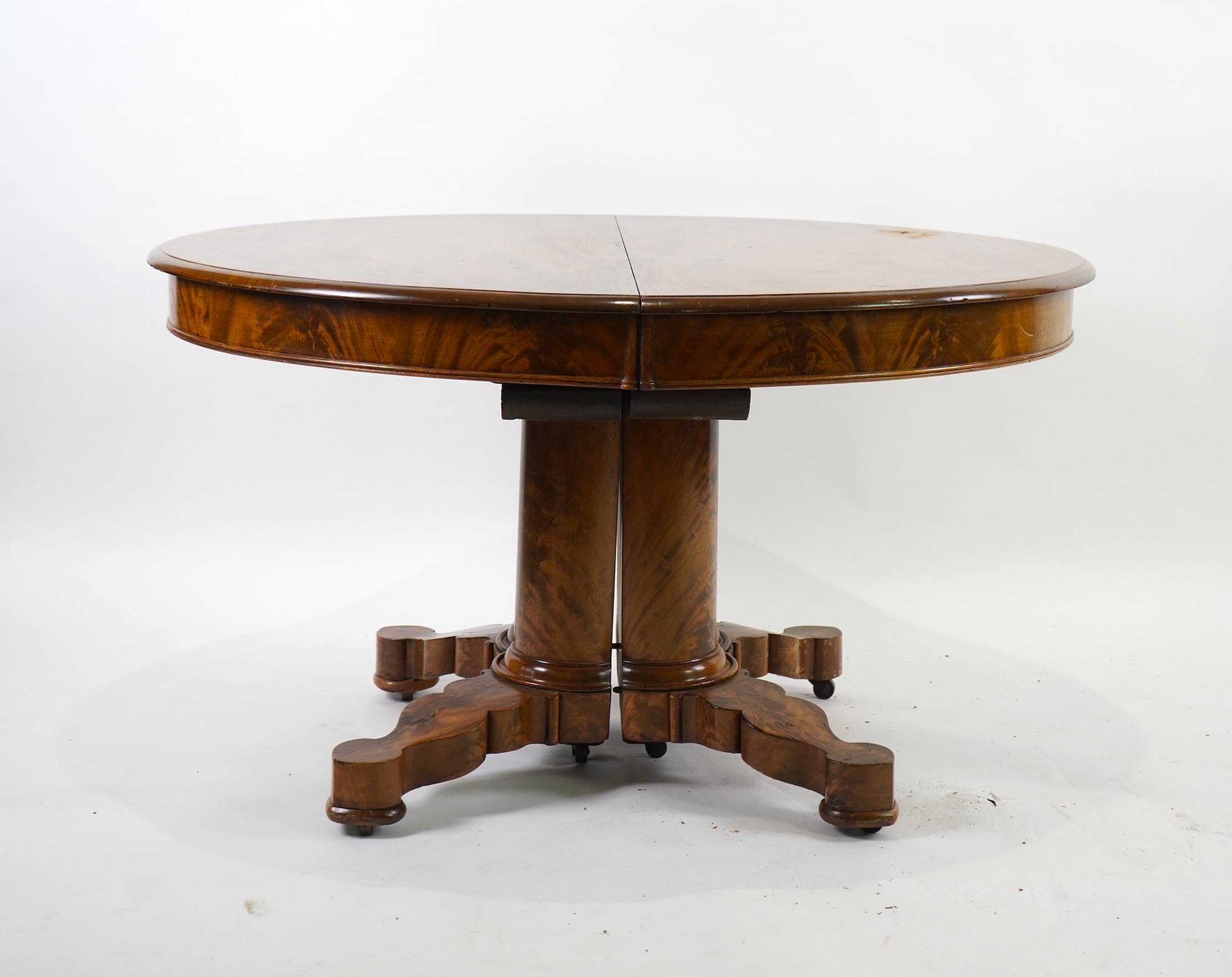A mid 19th century Continental mahogany extending dining table